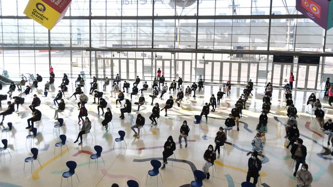 Students wait for their turn to receive their first dose of the Pfizer vaccine in Sydney on August 9. Picture: AFP