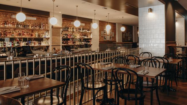 Inside Leonards Bar &amp; Bistro, Brisbane with its long back-lit bar.