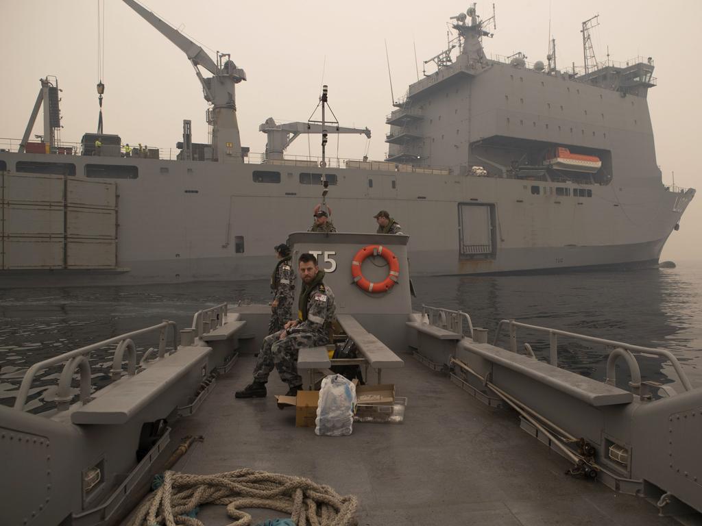 A Landing Craft departing HMAS Choules head towards the beach at Mallacoota, Victoria, to begin ferrying bushfire evacuees from the mainland. Picture: AAP