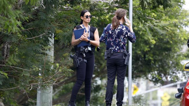 Detectives at the complex following the shooting on Wednesday morning. Picture: Tertius Pickard