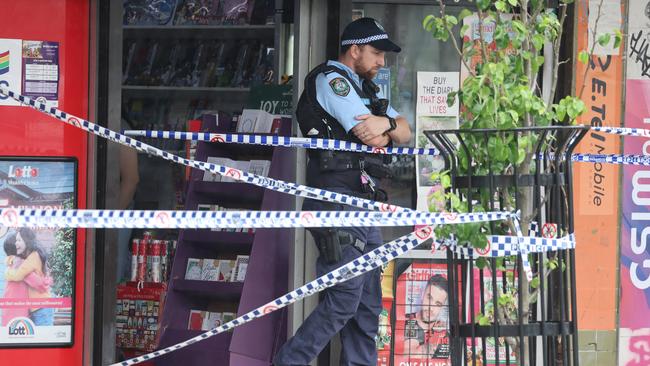 Police outside Buzzy Bee's Burger House, Cambridge Park where the bodies were found on Saturday. Picture: Rohan Kelly.