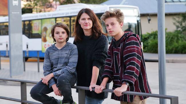 Mosman resident Lynda Turnbull and her sons Cooper, 12, and Spencer, 14, regularly witness bus drivers verbally abuse confused tourists on bus route 238 which runs between Taronga Zoo Wharf and Balmoral Beach. Picture: Braden Fastier