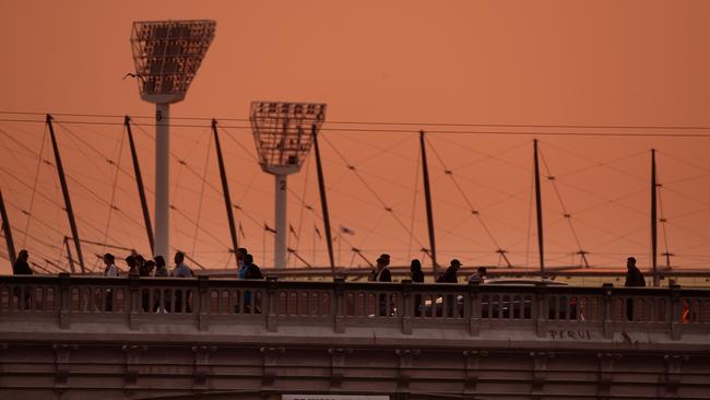 Melbourne woke up to an eerie orange sunrise this morning. Picture: Andrew Henshaw