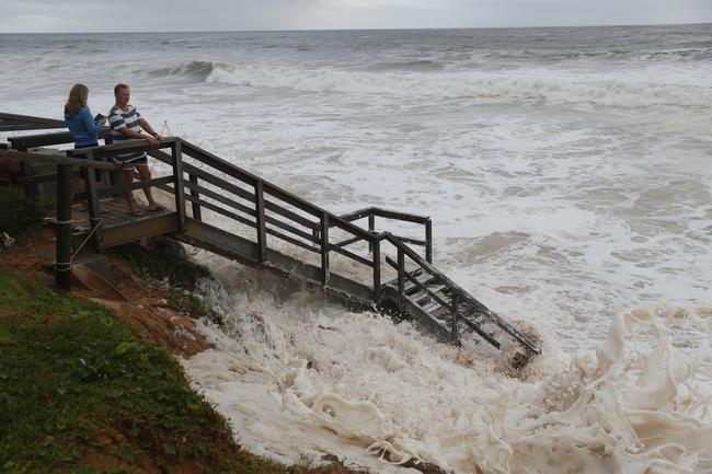 Foam is threatening to cover the homes damaged in the 2016 storms at Collaroy. Picture: John Grainger