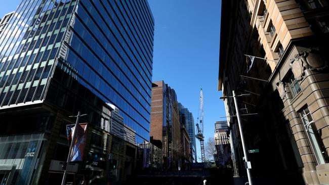 26th June 2021. A person walks in Martin Place in a virtually empty Sydney CBD during a Covid-19 lockdown. Picture by Damian Shaw