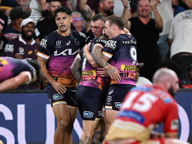 BRISBANE, AUSTRALIA - MARCH 24: Kurt Capewell of the Broncos celebrates scoring a try with team mates during the round four NRL match between the Dolphins and Brisbane Broncos at Suncorp Stadium on March 24, 2023 in Brisbane, Australia. (Photo by Bradley Kanaris/Getty Images)