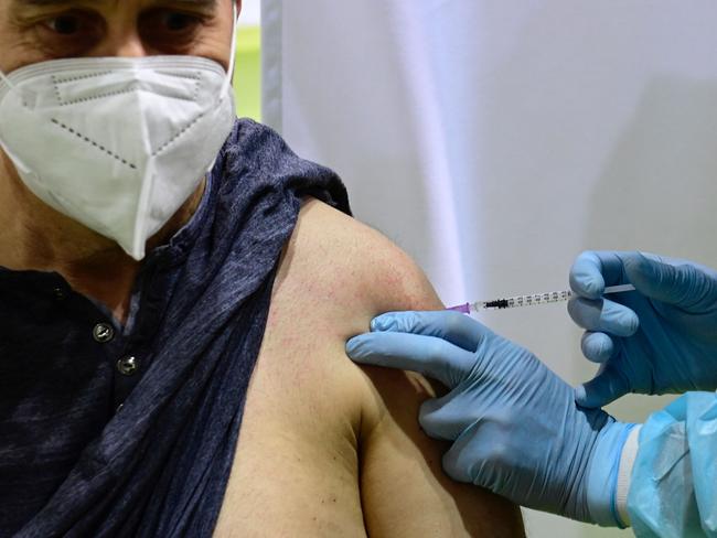 A patient receives an AstraZeneca jab at a new vaccination centre at the former Tempelhof airport in Berlin, Germany. Picture: AFP