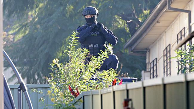 Police conduct raids in Punchbowl. Picture: Adam Yip