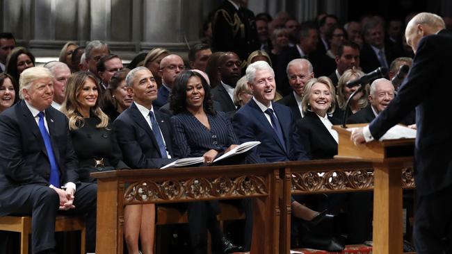 From left, Donald Trump, Melania Trump, Barack Obama, Michelle Obama, Bill Clinton, Hillary Clinton, and former President Jimmy Carter listen as former Senator Alan Simpson speaks during the funeral. Picture: AP.