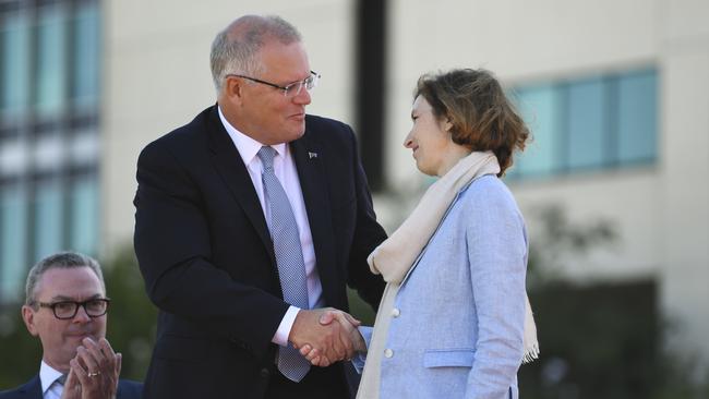 Prime Minister Scott Morrision (left) and French Defence Minister Florence Parly shake hands during the signing ceremony for the Attack class submarine Strategic Partnership Agreement in Canberra in February 2019.