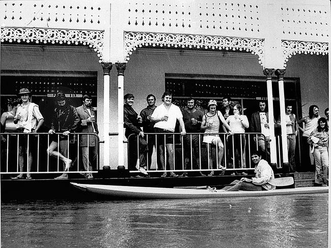 Patrons on the veranda of the Regatta Hotel
