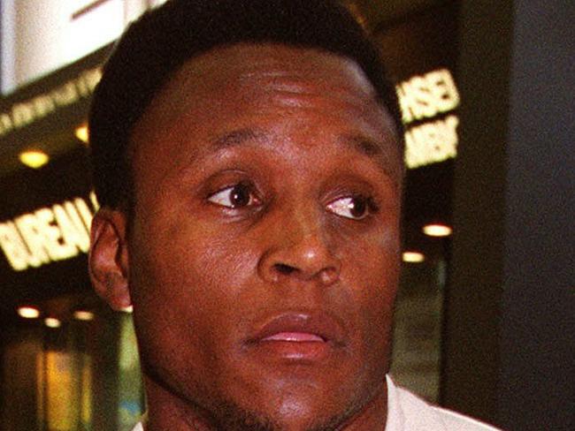 Detroit Lions running back Barry Sanders walks through London's Gatwick Airport after arriving from Detroit. Sanders has announced his retirement from football on Wednesday. ``My desire to exit the game is greater than my desire to remain in it. I have searched my heart through and through and feel comfortable with this decision,'' Sanders said in a statement released today. (AP Photo/Alastair Grant). p/. 28 July 1999.