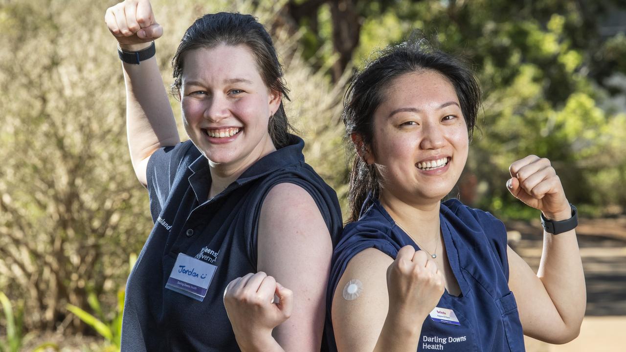 Jordan McConnell, paramedic (left) and Belinda Hu, registered nurse are proud to be part of the vaccination team for Queensland Health at the Toowoomba COVID-19 Vaccination Centre. Tuesday, October 5, 2021. Picture: Nev Madsen.