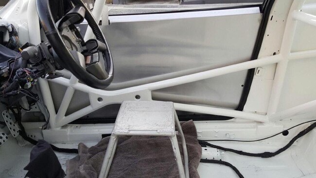 NSW Police highway patrol bust a Holden Commodore without a seat. Picture: NSW Police Facebook Page.