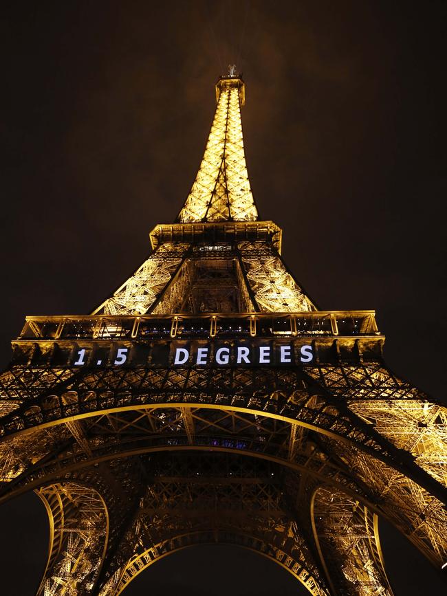 "1.5 Degrees" in white neon is lit on the Eiffel Tower in the French capital, as the COP21 United Nations Climate Change Conference takes place / Picture: AFP