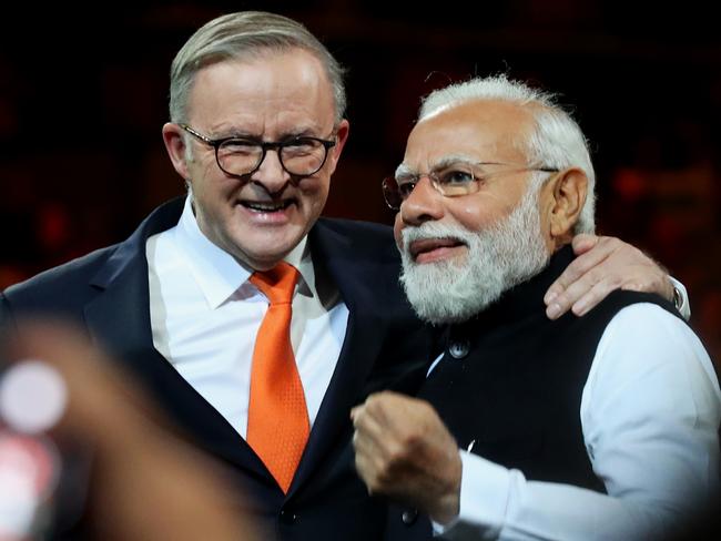 SYDNEY, AUSTRALIA - MAY 23: India's Prime Minister Narendra Modi (R) and Australia's Prime Minister Anthony Albanese embrace while attending an Indian cultural event on May 23, 2023 at the Qudos Bank Arena in Sydney, Australia. Modi is visiting Australia on the heels of his and Australia's Prime Minister Anthony Albanese's participation in the G7 Summit in Japan. (Photo by Lisa Maree Williams/Getty Images)