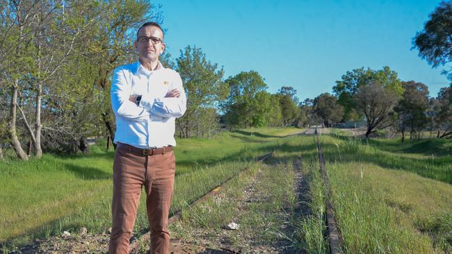 Tony Piccolo stands beside the disused Barossa rail line. The Light MP has set up a task force to investigate the viability of reviving the Barossa wine train. Picture: Supplied