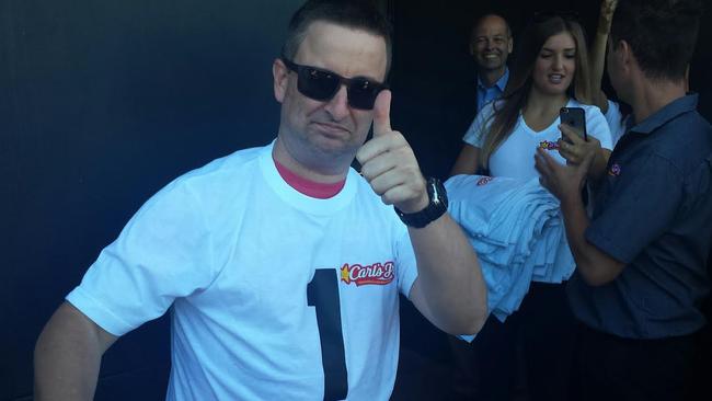 No.1 gun: Novocastrian Matt Elsey, 41, is the first person through the doors, earning himself a year's free food, on the opening day of Carl's Jr at Bateau Bay.