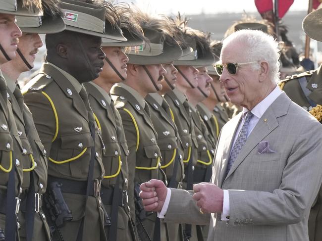 SYDNEY, AUSTRALIA - OCTOBER 22: Britain's King Charles III, right, gestures beside honor guards during his visit to Sydney Opera House on October 22, 2024 in Sydney, Australia. The King's visit to Australia is his first as monarch, and the Commonwealth Heads of Government Meeting (CHOGM) in Samoa will be his first as head of the Commonwealth. (Photo by Mark Baker - Pool/Getty Images)