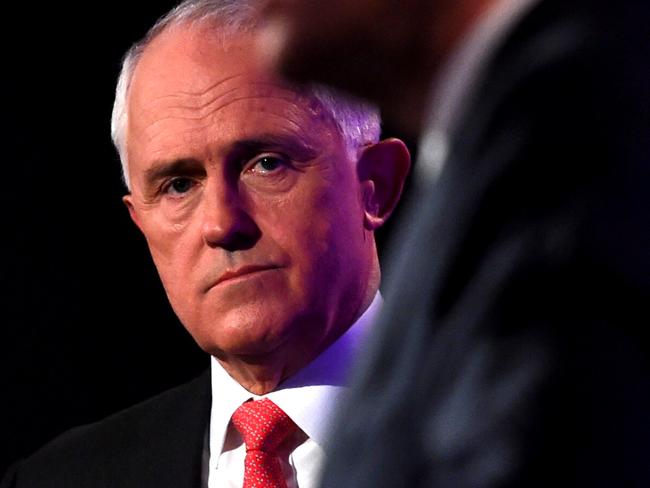 Prime Minister Malcolm Turnbull (left) looks at Opposition Leader Bill Shorten as he speaks at the leaders' debate at the National Press Club in Canberra, Sunday, May, 29, 2016. (AAP Image/Tracey Nearmy) NO ARCHIVING