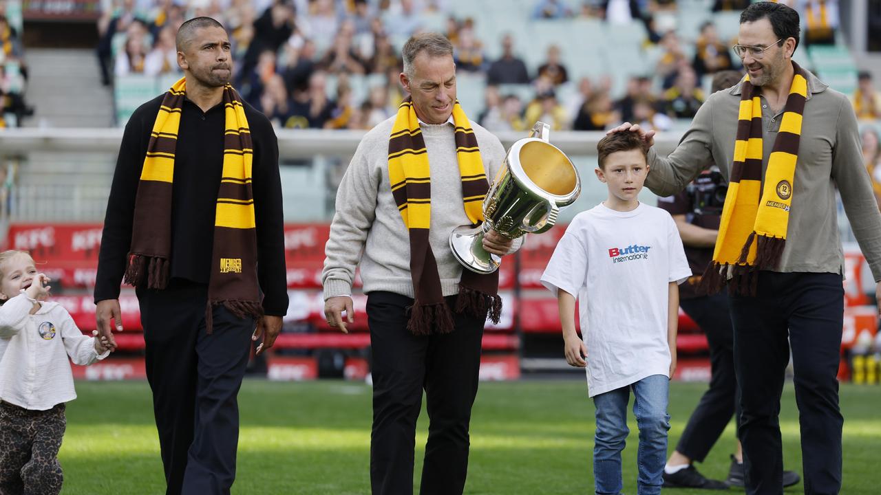 Alastair Clarkson carried a premiership cup alongside Jordan Lewis.