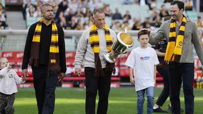 Alastair Clarkson carried a premiership cup alongside Jordan Lewis.