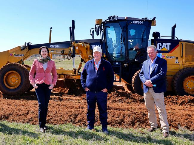 Premier Annastacia Palaszczuk at the site of a quarantine hub that will be built at Wellcamp Airport in Toowoomba with John Wagner and Joe Wagner. Picture: Jack Tran