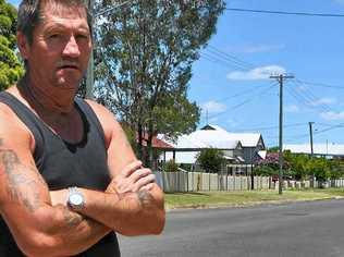 Guy Harvey surveys the hoon track marks left out the front of his Fitzroy St residence.