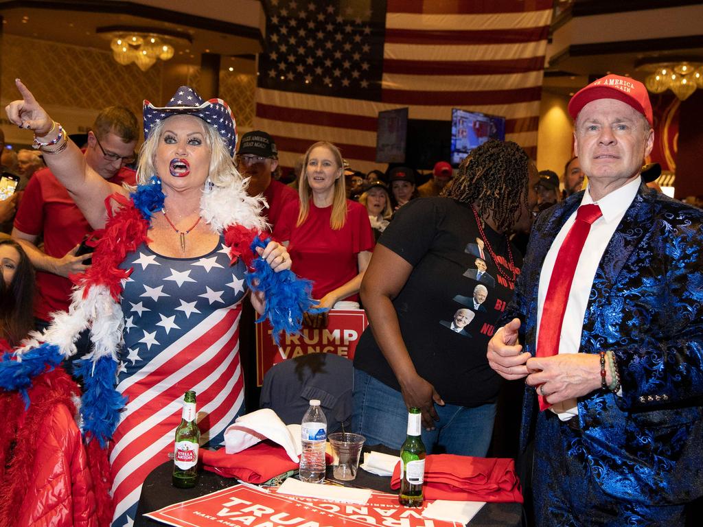 Stephanie Smith, left, and Thomas Brewer react to election results at the Nevada Grand Old Republican election watch party in Las Vegas, Nevada. Picture: AFP.