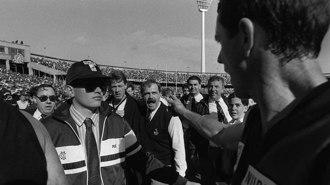 Leigh Matthews confronts Terry Daniher at halftime of the 1990 Grand Final.