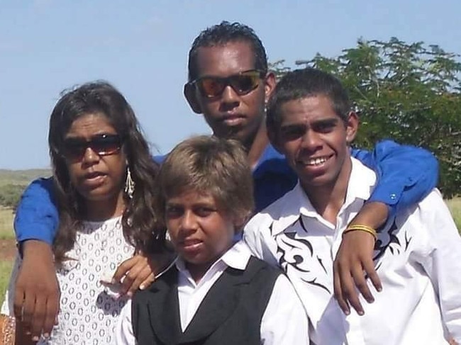 Cook, aged 18, with his brothers and mother. Picture: Supplied