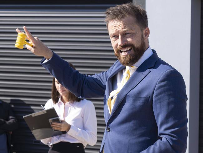 FAIRFIELD ADVANCE/AAP. A fire-damaged house in Fairfield West being sold at auction today. The house is extensively damaged but still saw solid bidding selling for $750,000. The auction action and auctioneer James Kerley photographed today 18th May 2019. (AAP/Image Matthew Vasilescu