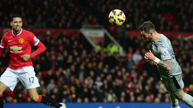 Danny Ings of Burnley scores a diving header.