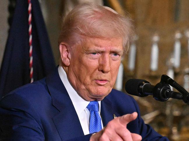 TOPSHOT - US President Donald Trump speaks during signing of executive orders at his Mar-a-Lago resort in Palm Beach, Florida, on February 18, 2025. (Photo by ROBERTO SCHMIDT / AFP)