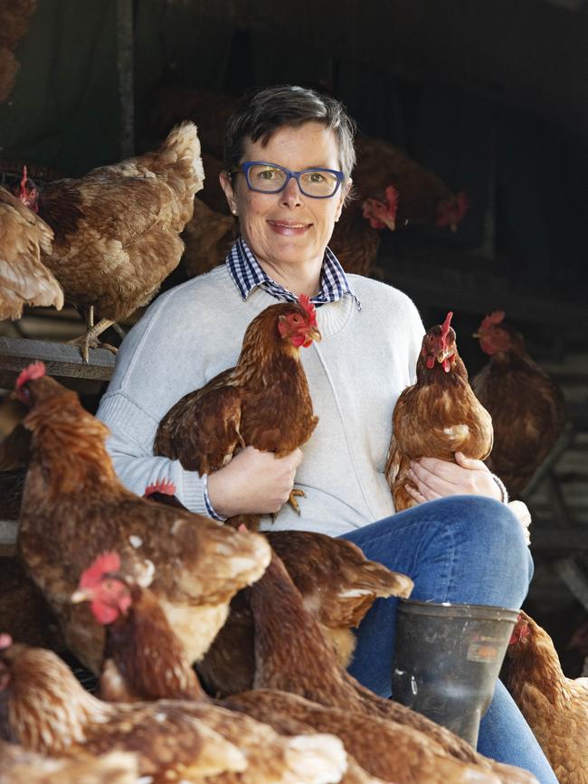 Cath with her hens in one of the mobile sheds. Picture: Zoe Phillips