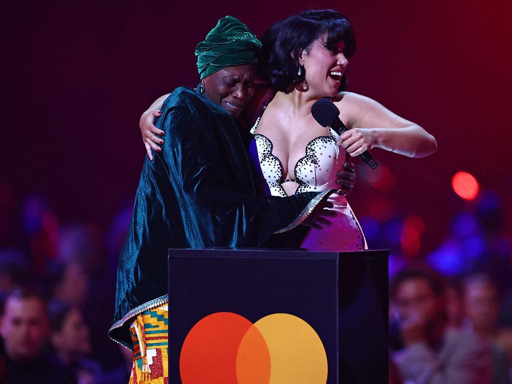 Raye takes her grandmother onto the stage as she is awarded Album of the Year for My 21st Century Blues. Picture: AFP