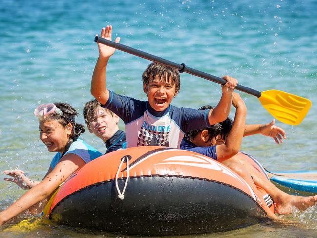 Gabrielle, 13, Noah, 13, Alec (front), 12, and Noah, 10, enjoying the weather at Inverloch. Picture: Mark Stewart