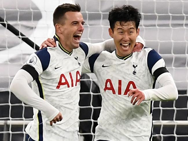 Tottenham Hotspur's Argentinian midfielder Giovani Lo Celso (L) celebrates scoring his teams second goal with Tottenham Hotspur's South Korean striker Son Heung-Min (R) during the English Premier League football match between Tottenham Hotspur and Manchester City at Tottenham Hotspur Stadium in London, on November 21, 2020. (Photo by NEIL HALL / POOL / AFP) / RESTRICTED TO EDITORIAL USE. No use with unauthorized audio, video, data, fixture lists, club/league logos or 'live' services. Online in-match use limited to 120 images. An additional 40 images may be used in extra time. No video emulation. Social media in-match use limited to 120 images. An additional 40 images may be used in extra time. No use in betting publications, games or single club/league/player publications. /