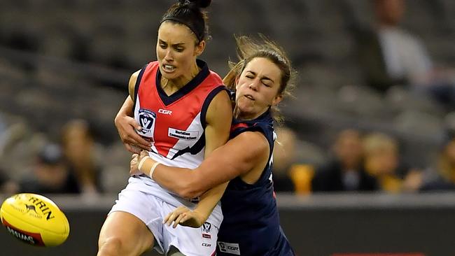 Chloe Molloy lays a tackle on Libby Birch during the VFL Women’s grand final. Picture: Andy Brownbill.