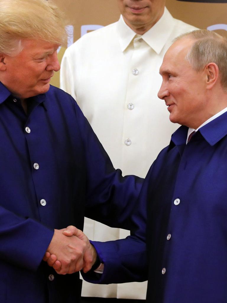 US President Donald Trump (L) shakes hands with Russia's President Vladimir Putin. Picture: AFP