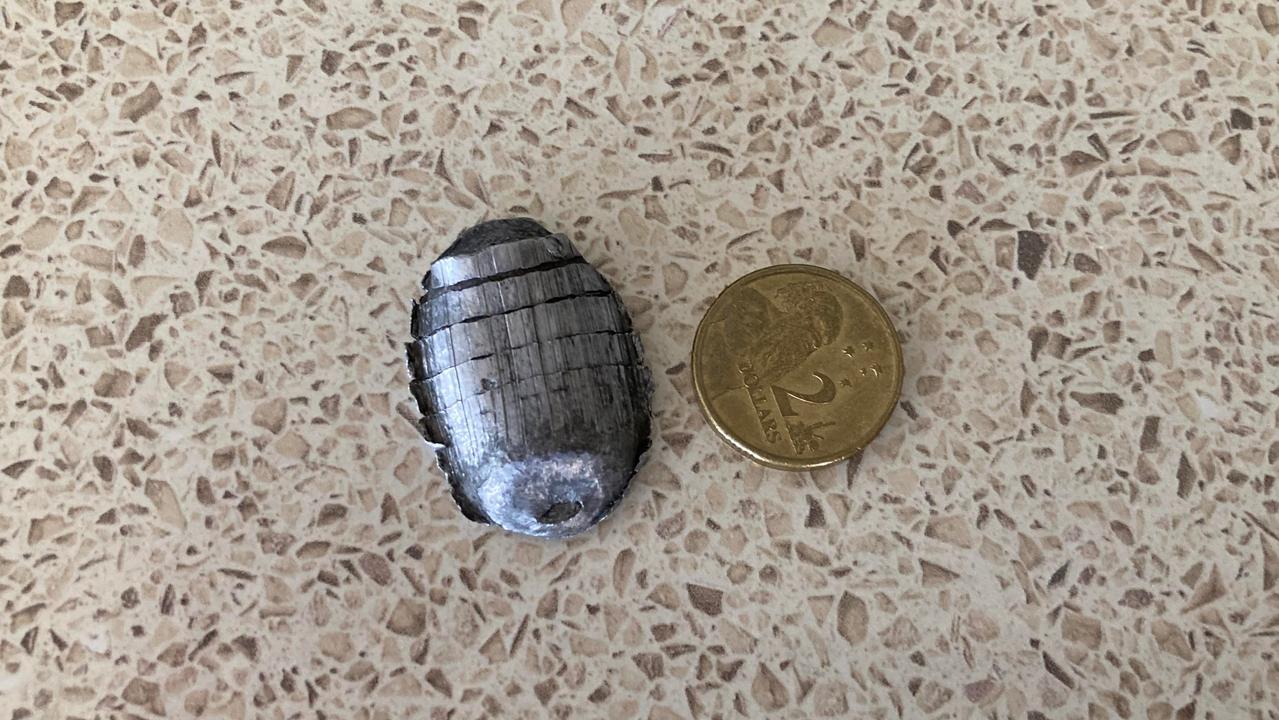 A Gympie family has not been able to identify the source of the falling metal, which was about 3cm long.