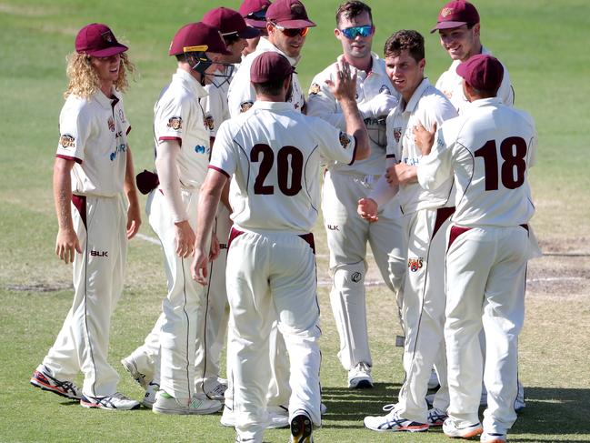 Mitch Swepson of Queensland is congratulated by teammates after dismissing Matthew Kelly of Western Australia during day 4 of the Marsh Sheffield Shield cricket match between the Western Warriors and the Queensland Bulls at the WACA Ground in Perth, Monday, March 9, 2020. (AAP Image/Richard Wainwright) NO ARCHIVING