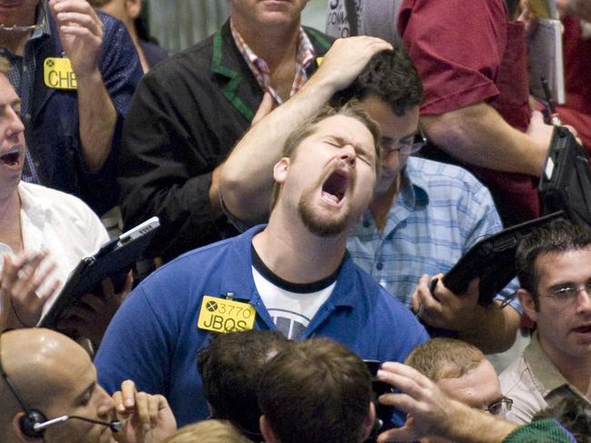 ** FOR USE AS DESIRED WITH YEAR END -- FILE ** In this Aug. 21, 2008 file photo, traders work in the options pit at the New York Mercantile Exchange. (AP Photo/Richard Drew, file)