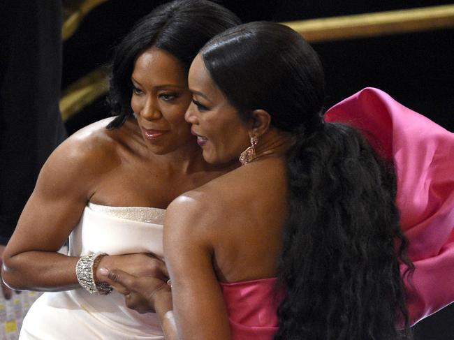 Regina King, left, and Angela Bassett pose for a photo in the audience prior to the start of the Oscars. Picture: AP