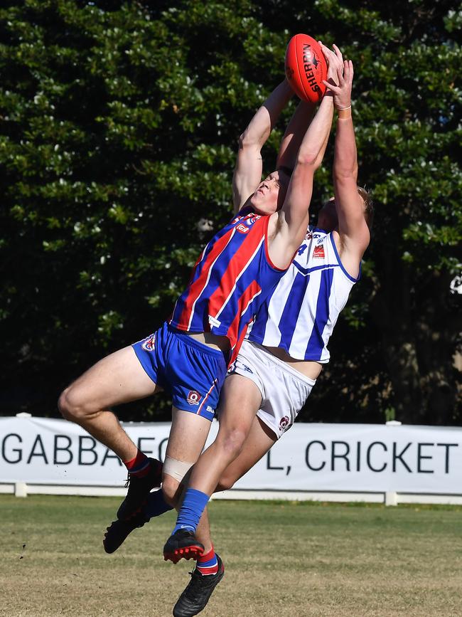 Wilston player Alexander Rodrick and Mt Gravatt player Brendan Telford. Picture, John Gass