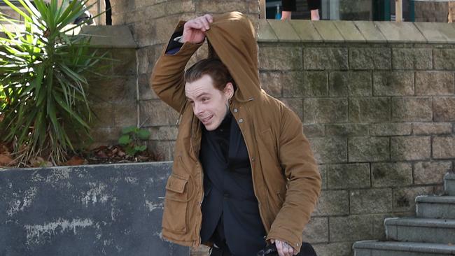 Mr Worthington, now 32, sported a brown ponytail and multiple tattoos outside court. Picture: NCA NewsWire / David Crosling