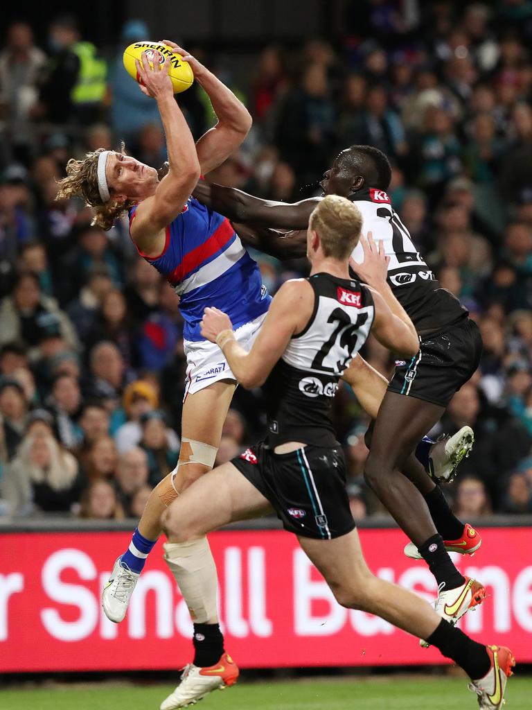 Naughton beating Aliir in the air again. Picture: Sarah Reed/AFL Photos