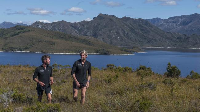 Wild Pedder’s Lou Balcombe, left, and Cody McCracken on Wilmot Island in the middle of Lake Pedder. Picture: CHRIS CRERAR