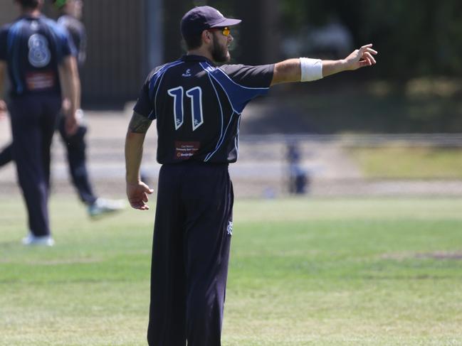 Prahran captain Jake Hancock adjusts his field. Picture: Stuart Milligan