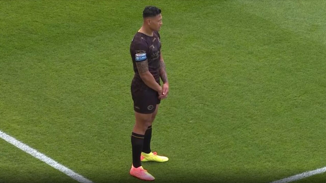 Israel Folau stands up during the moment of reflection